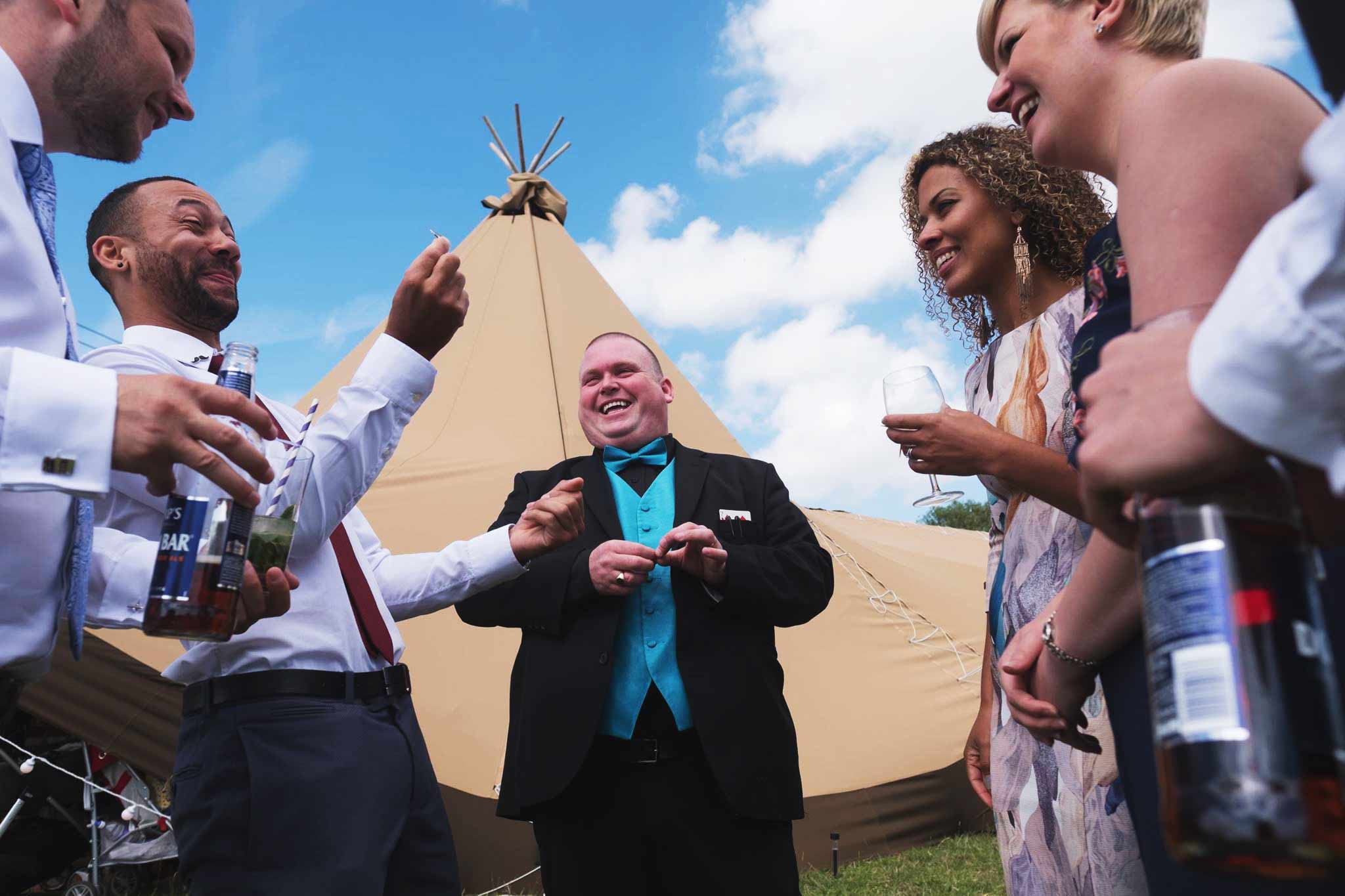 Derby wedding magician Paul Grundle performing close up magic to guests at a wedding